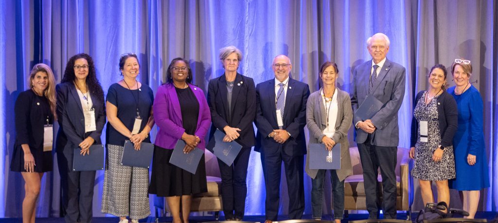 Photo of leaders on a stage at the Gold Humanism Summit